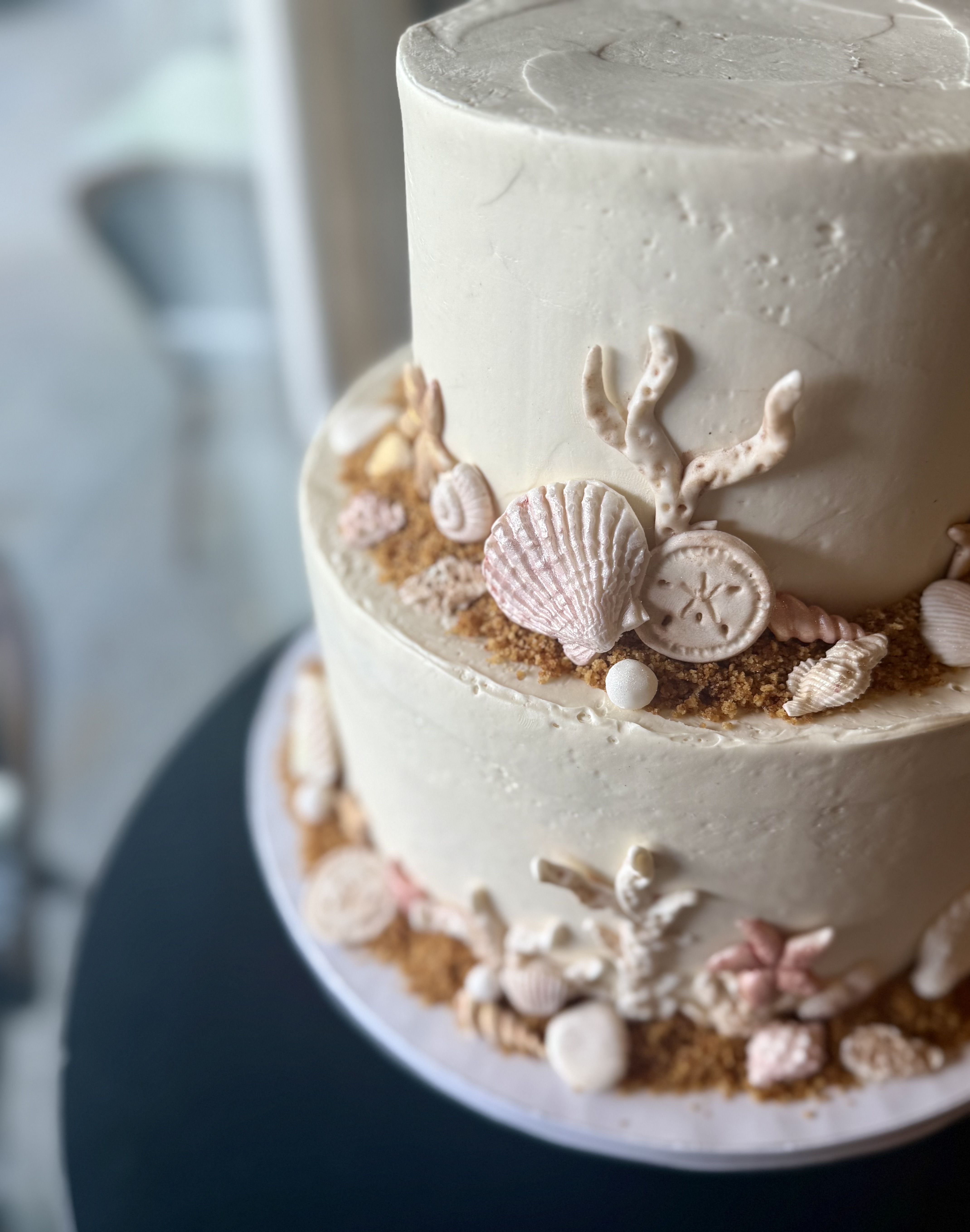 a cake with seashells on top