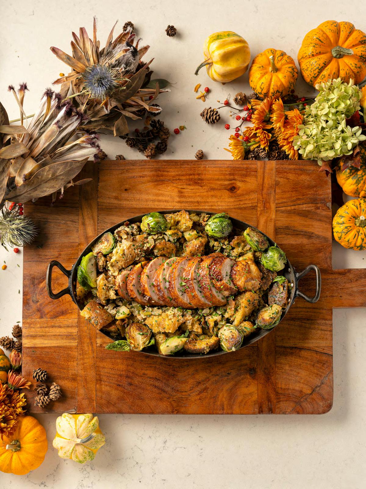 a banana sitting on top of a wooden cutting board