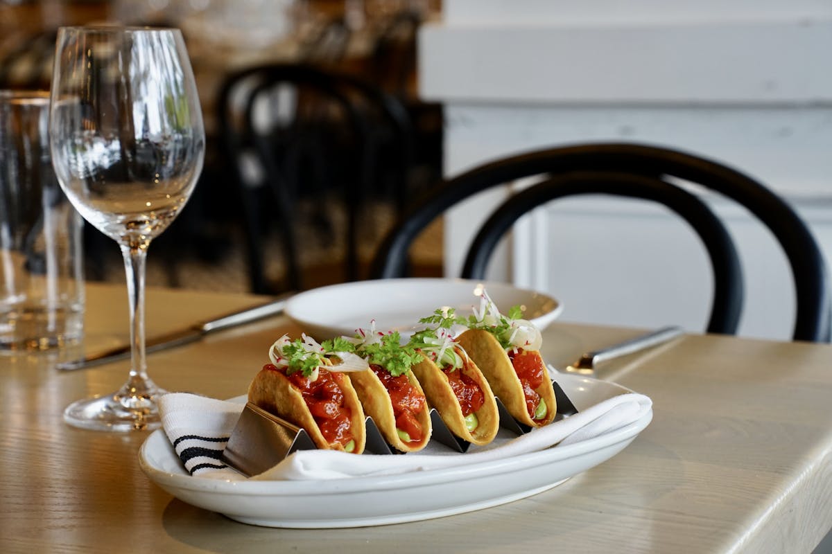 a plate of food and a glass of wine