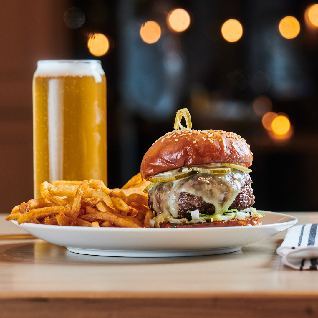 a plate of food and a glass of orange juice