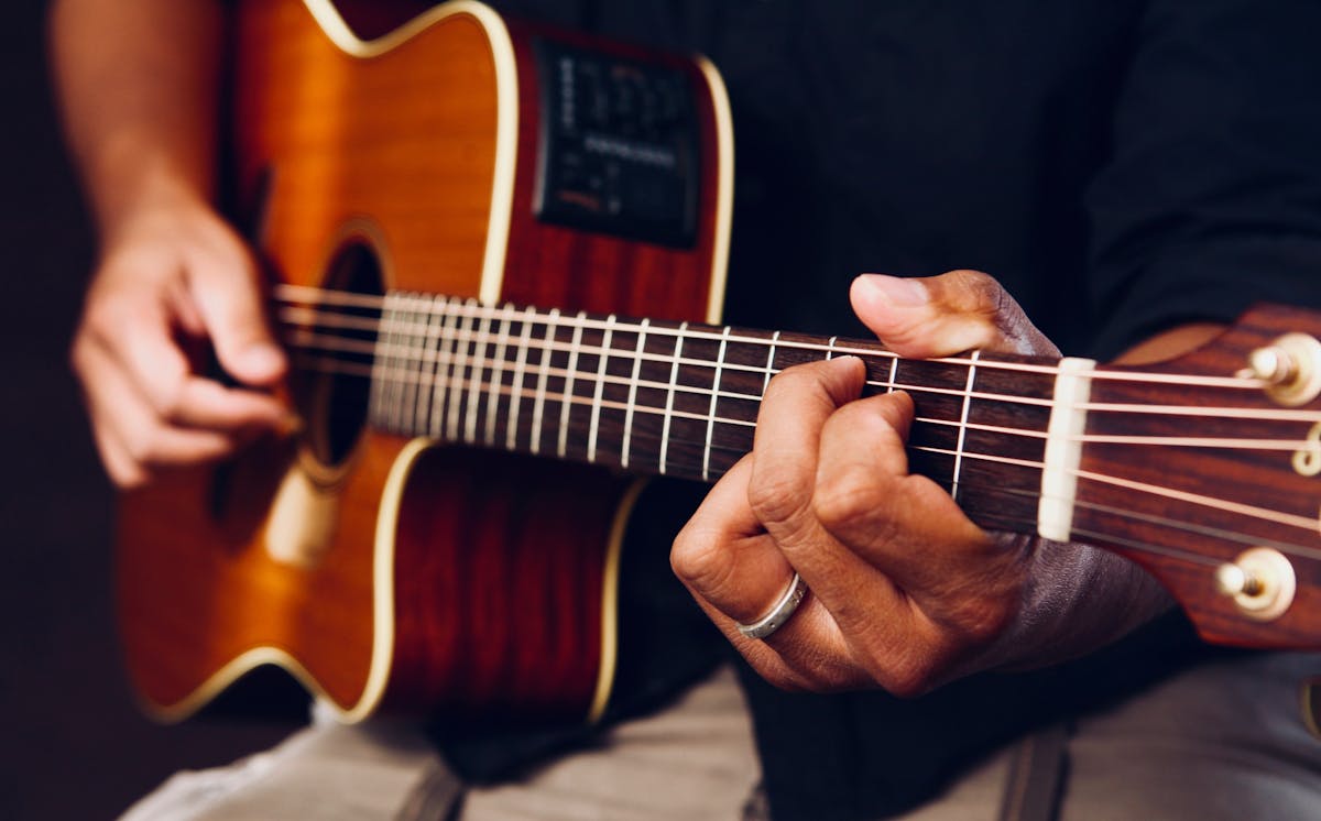 a person holding a guitar
