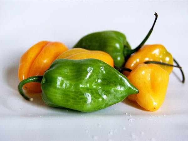 a bowl of fruit - aji verde peppers