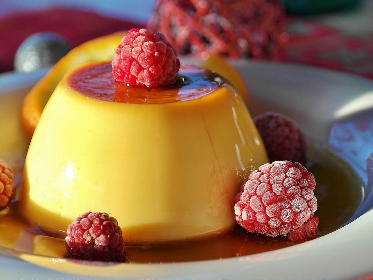 Crema volteada, a circular shape is observed, soft and gelatinous texture, yellow, it is also known as flan or cheese in Venezuela