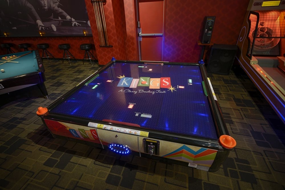 a laptop computer sitting on top of a table