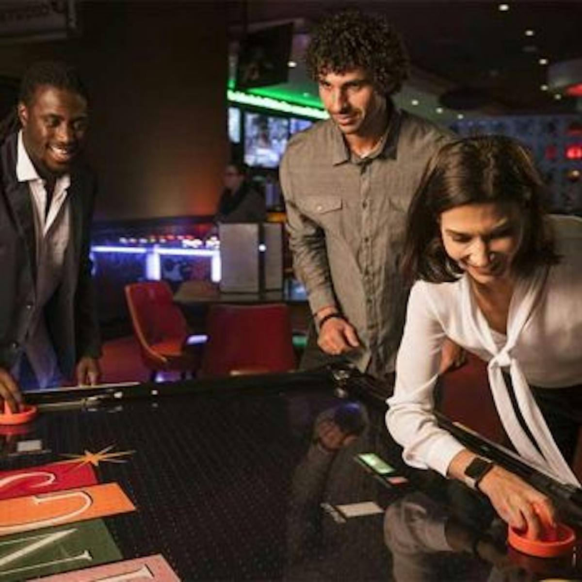 a group of people sitting at a desk