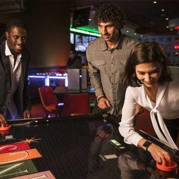 a group of people sitting at a desk