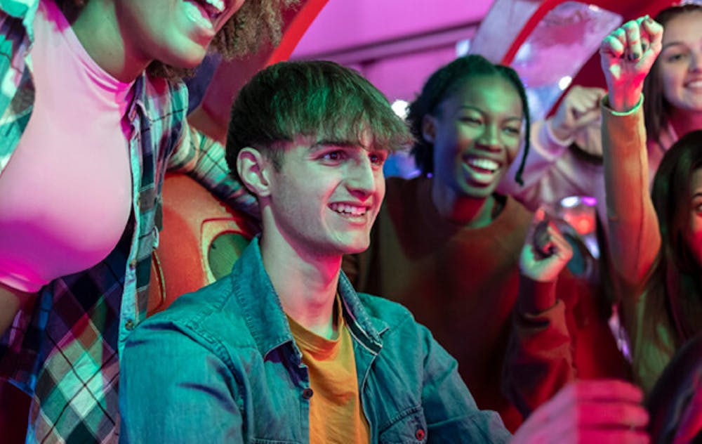 a group of people sitting and looking at the camera