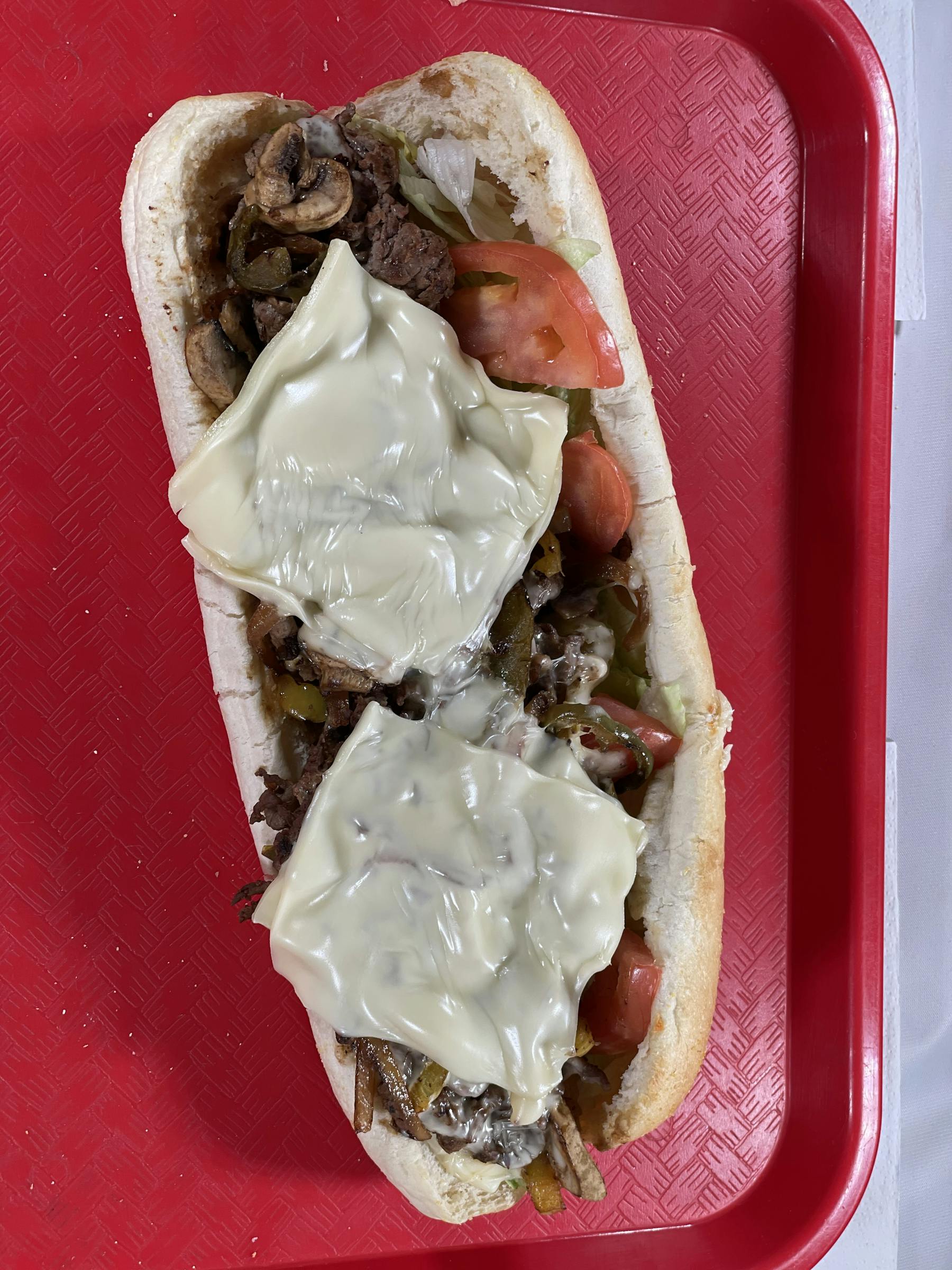 a hot dog covered in sauce