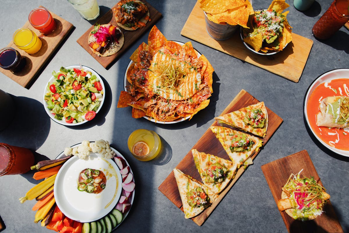 a bunch of different types of food on a table