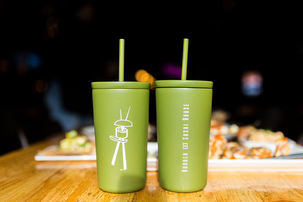 a cup of coffee sitting on top of a wooden table