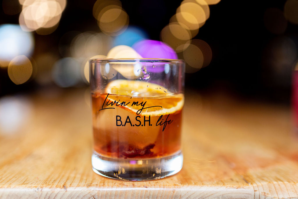 a close up of a glass of beer on a table