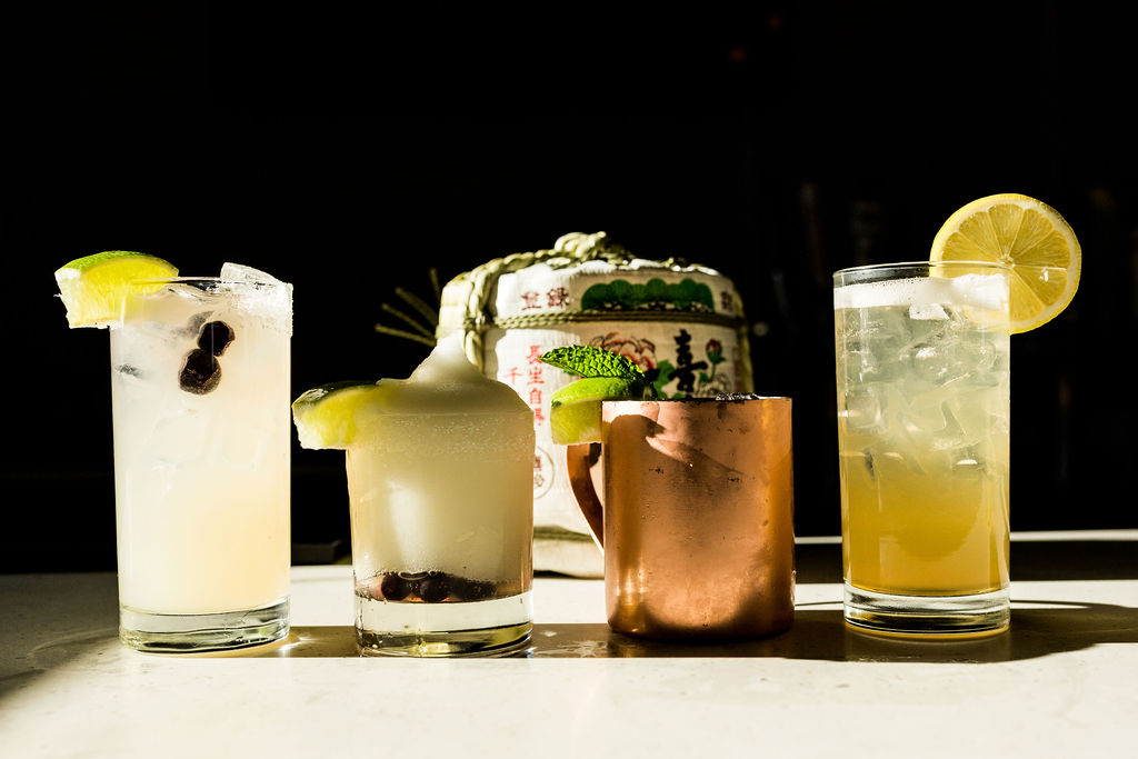 a glass of orange juice next to a cup of coffee