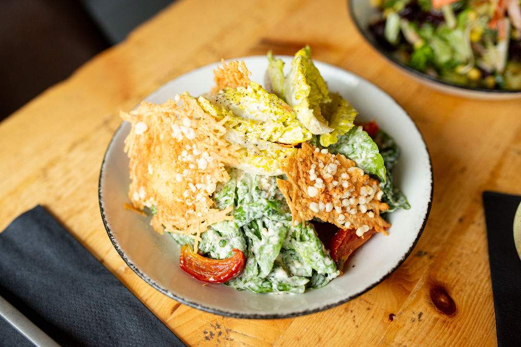a plate of food on a wooden table