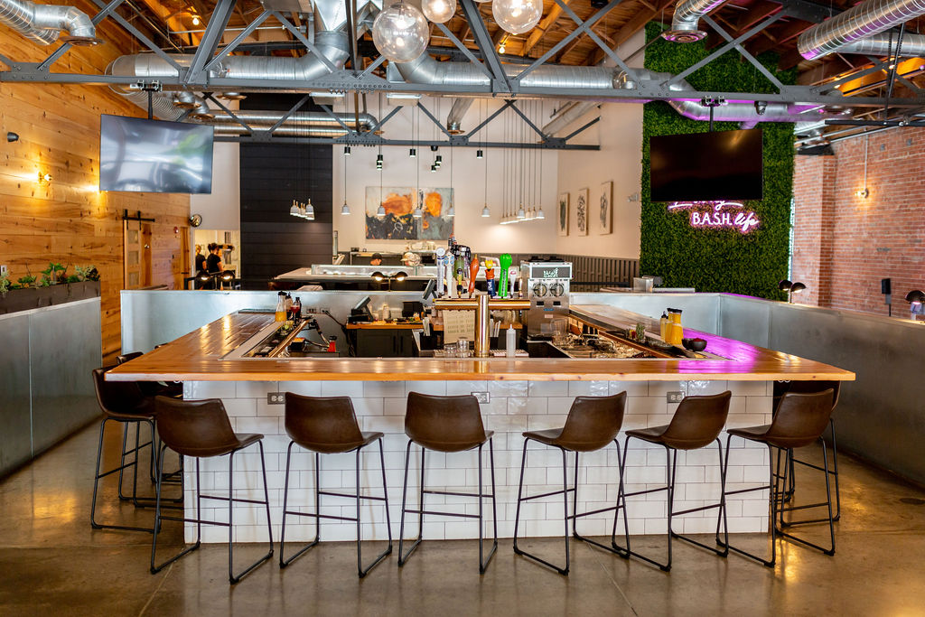 a kitchen with a table in a restaurant