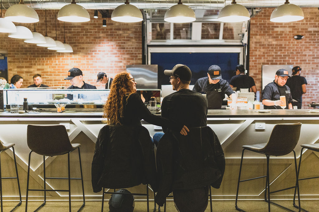 a group of people sitting at a table