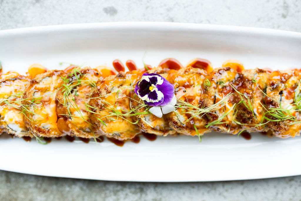 a plate of food with a slice of pizza