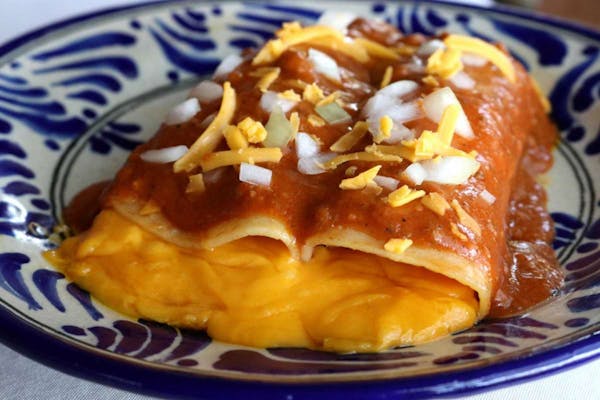 Enchilada Queen Sylvia Caseres' cheese enchiladas with chili gravy are among nearly two dozen enchiladas available at Sylvia's Enchilada Kitchen.
