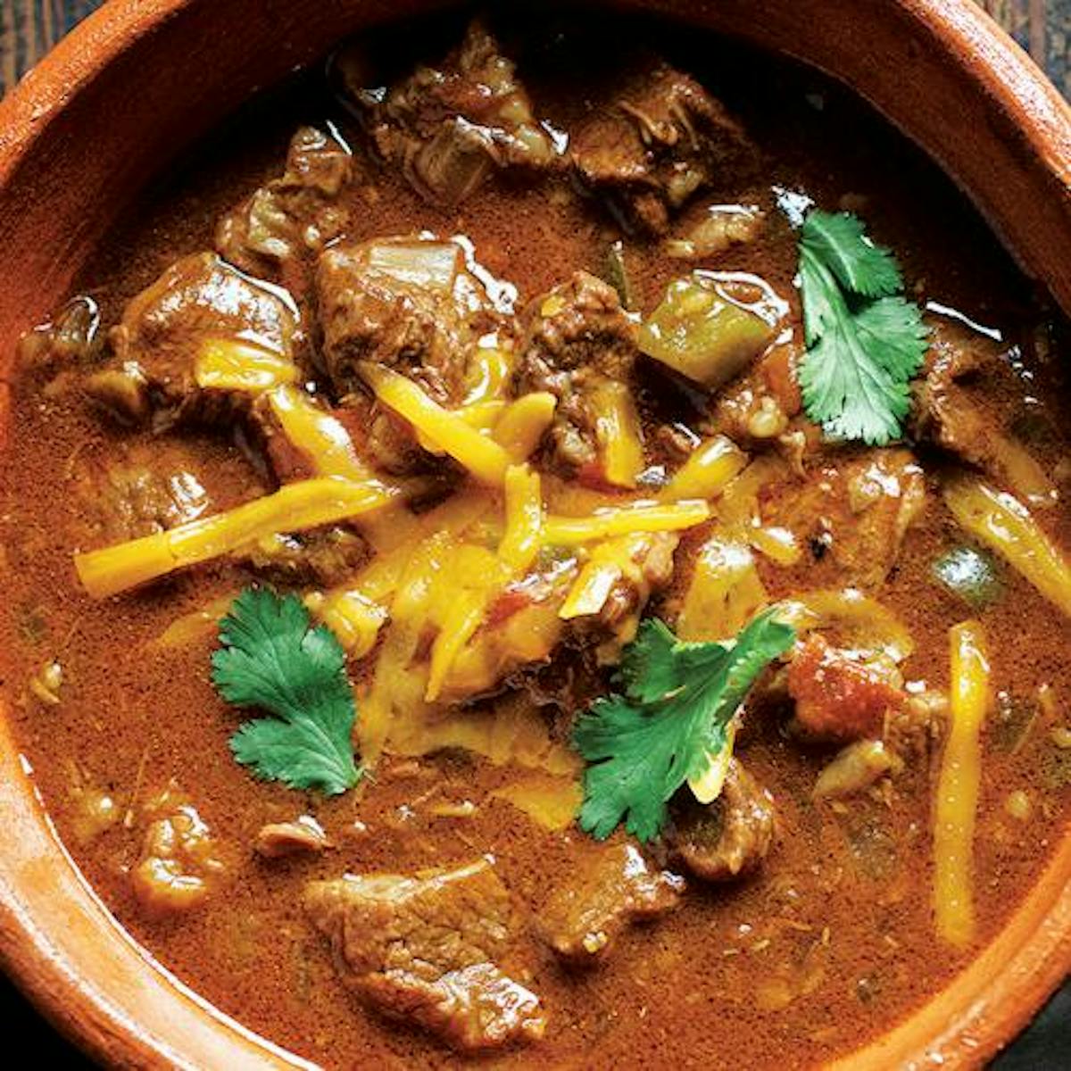 a bowl of soup with meat and vegetables