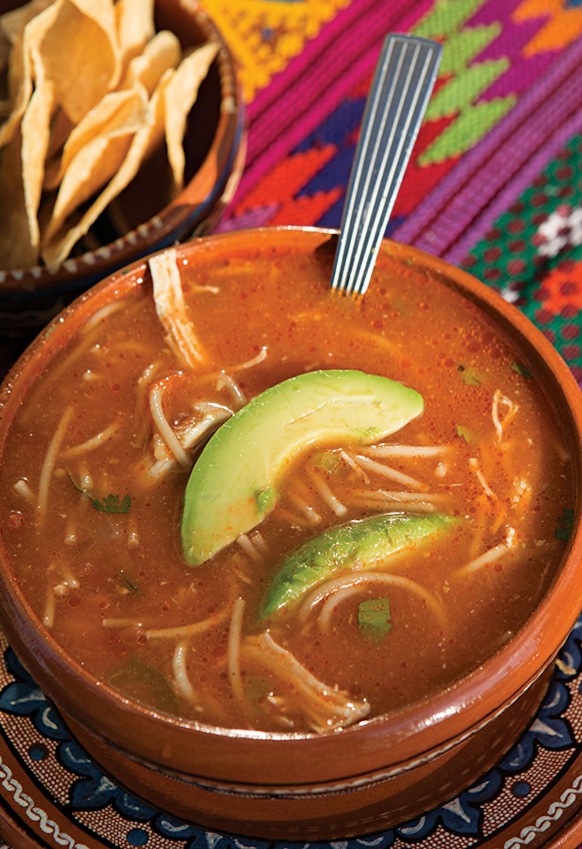 a bowl of soup and a spoon