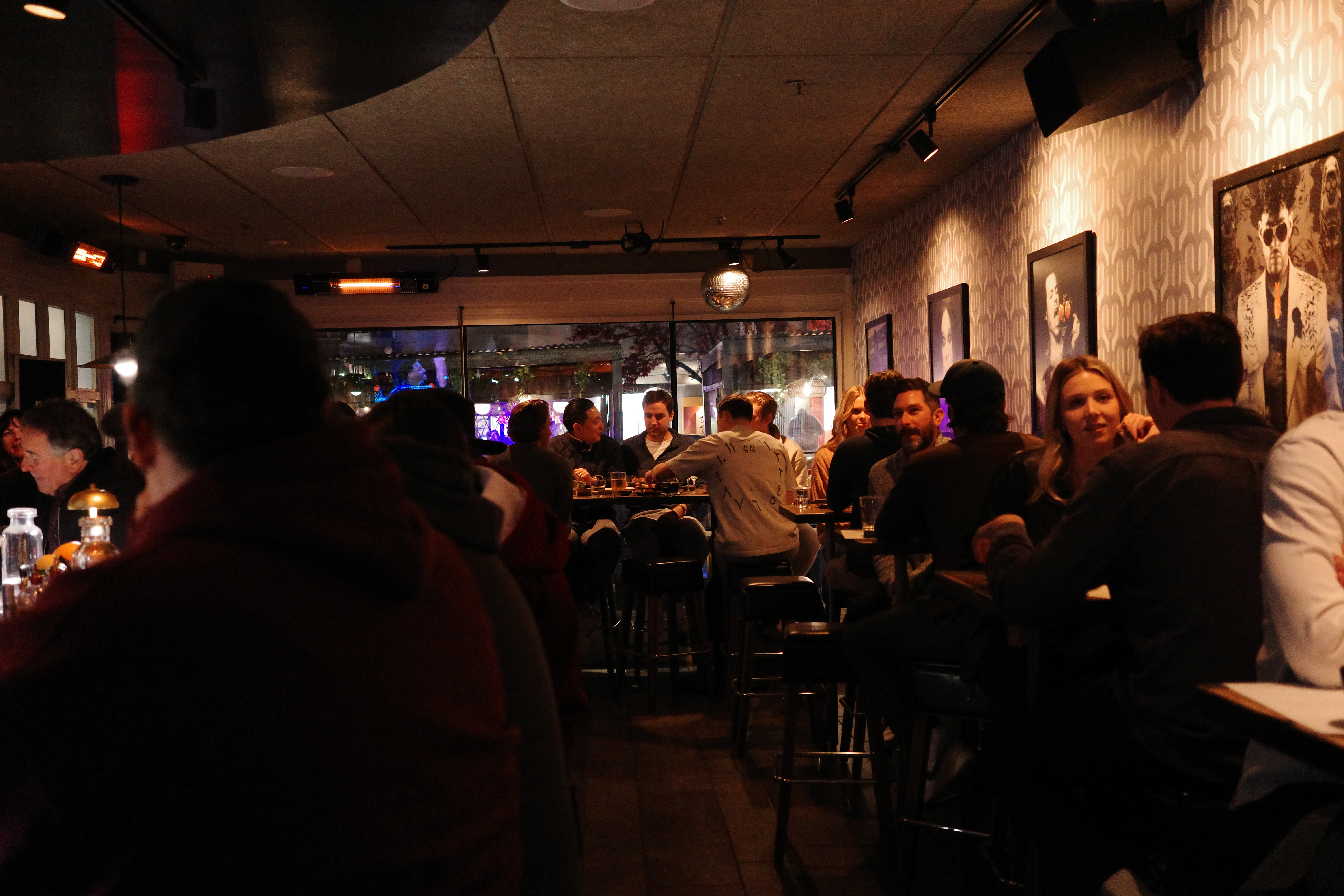 a group of people sitting at a table in front of a crowd