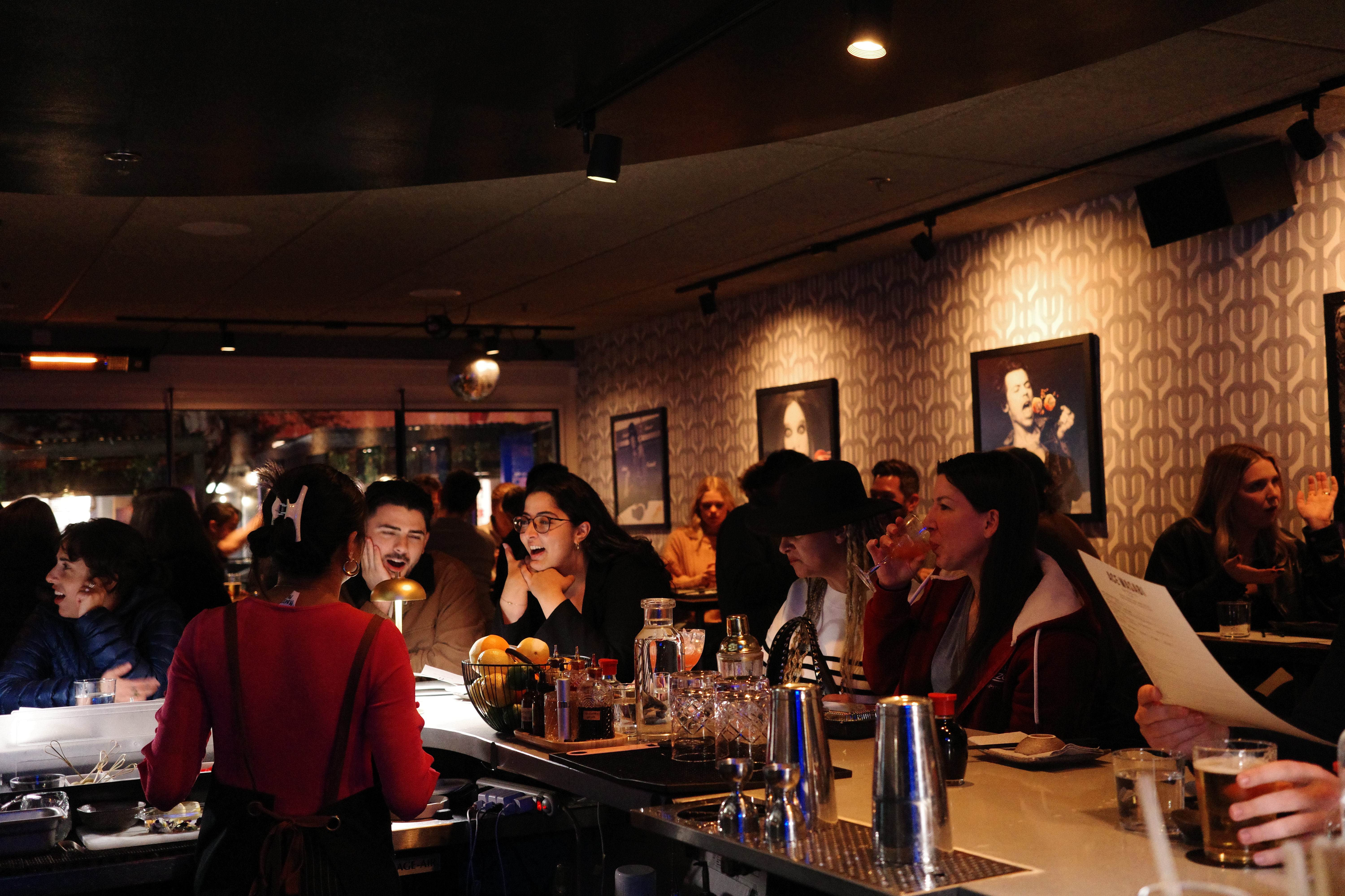 a group of people sitting at a table with wine glasses