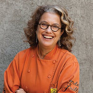 Susan Feniger in orange shirt