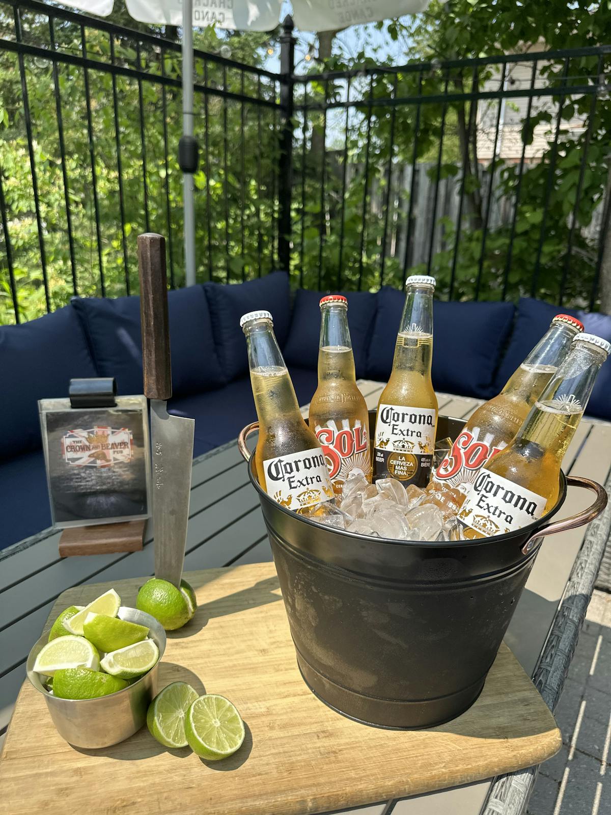 a bottle of wine sitting on top of a picnic table