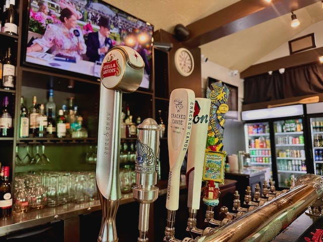 a bottle and a glass display case