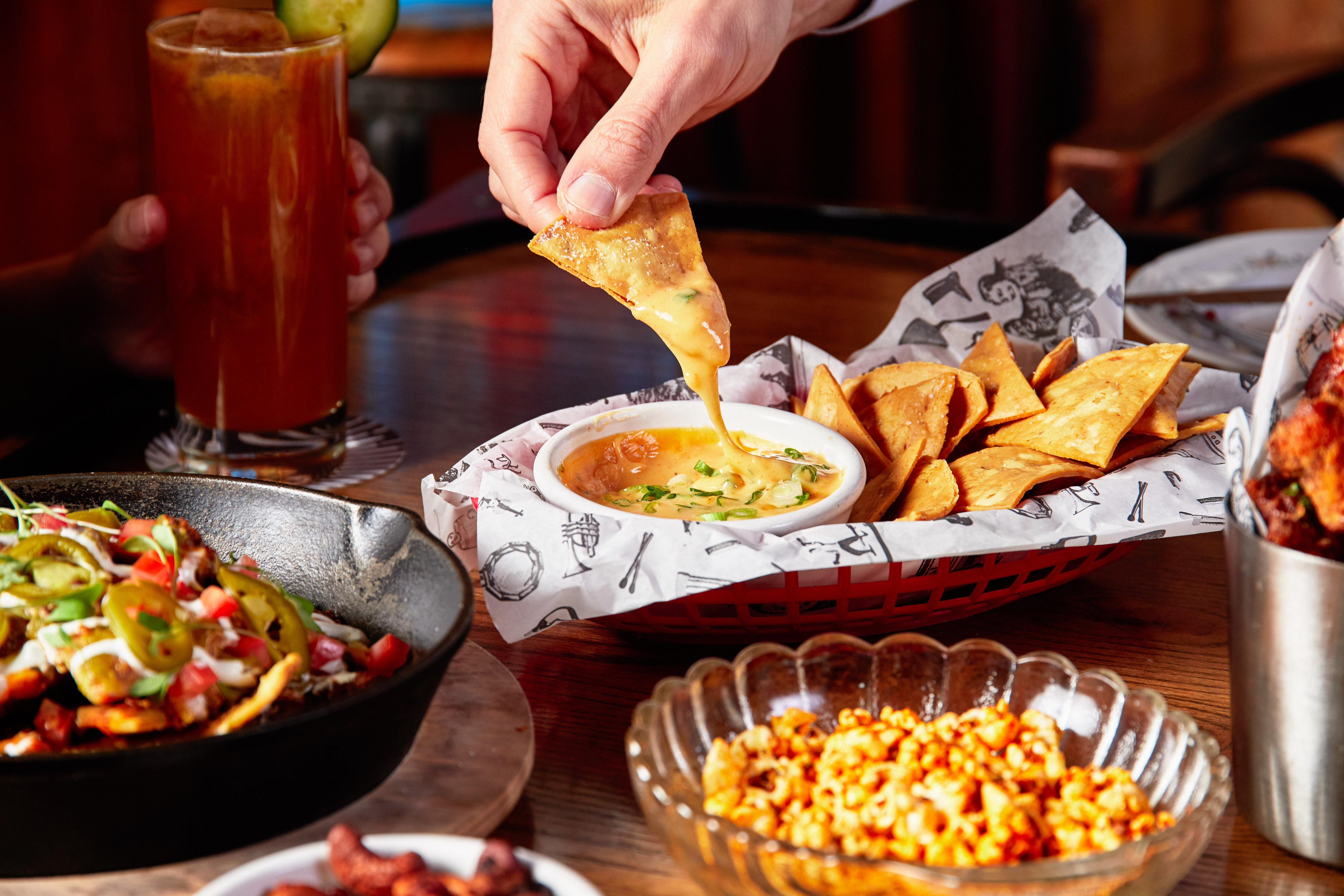 a person sitting at a table with a plate of food