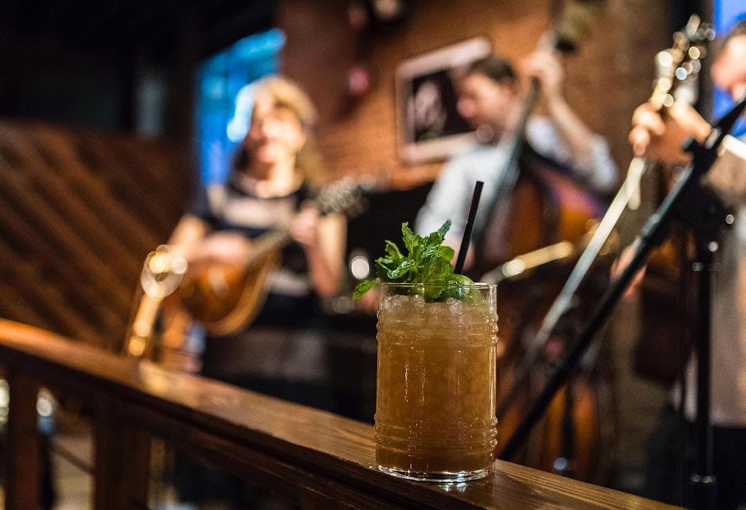 a cocktail and a live band at Porchlight