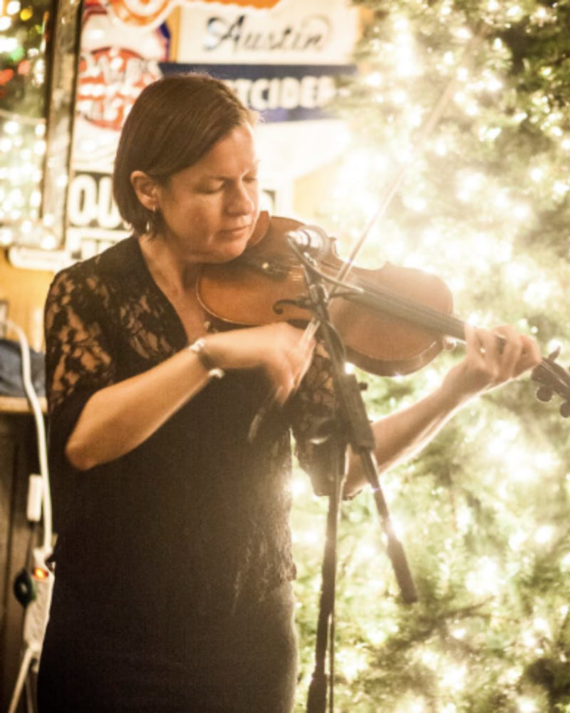 a person holding a wine glass