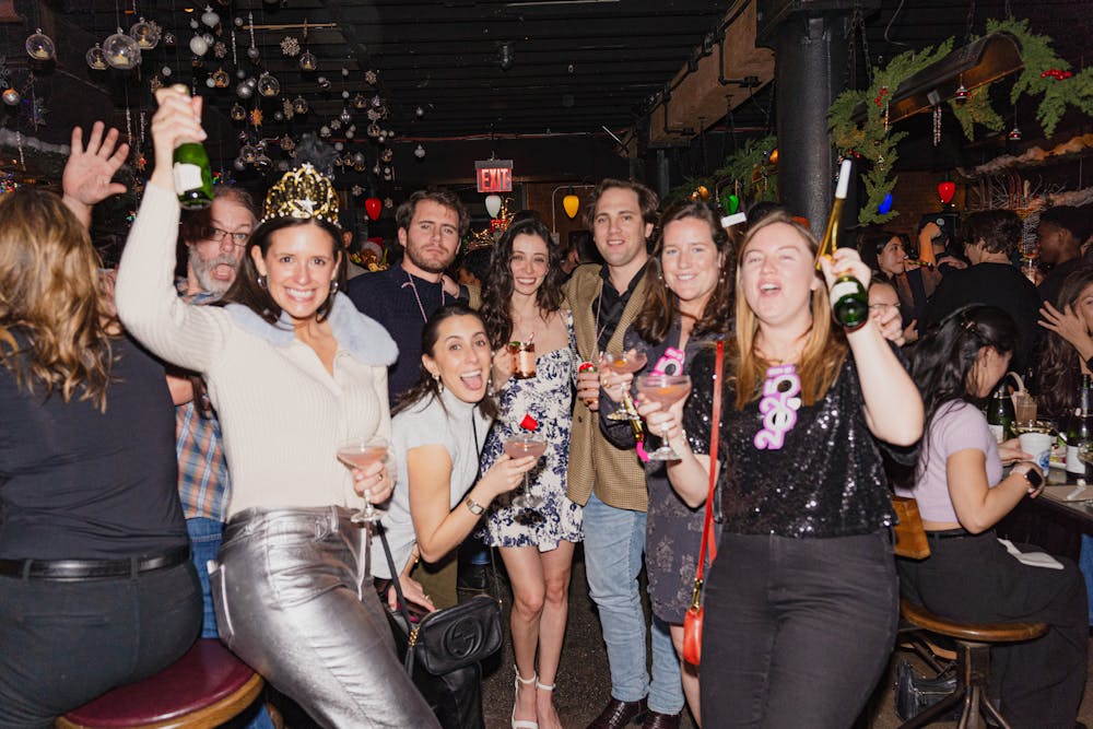 a group of people posing for the camera