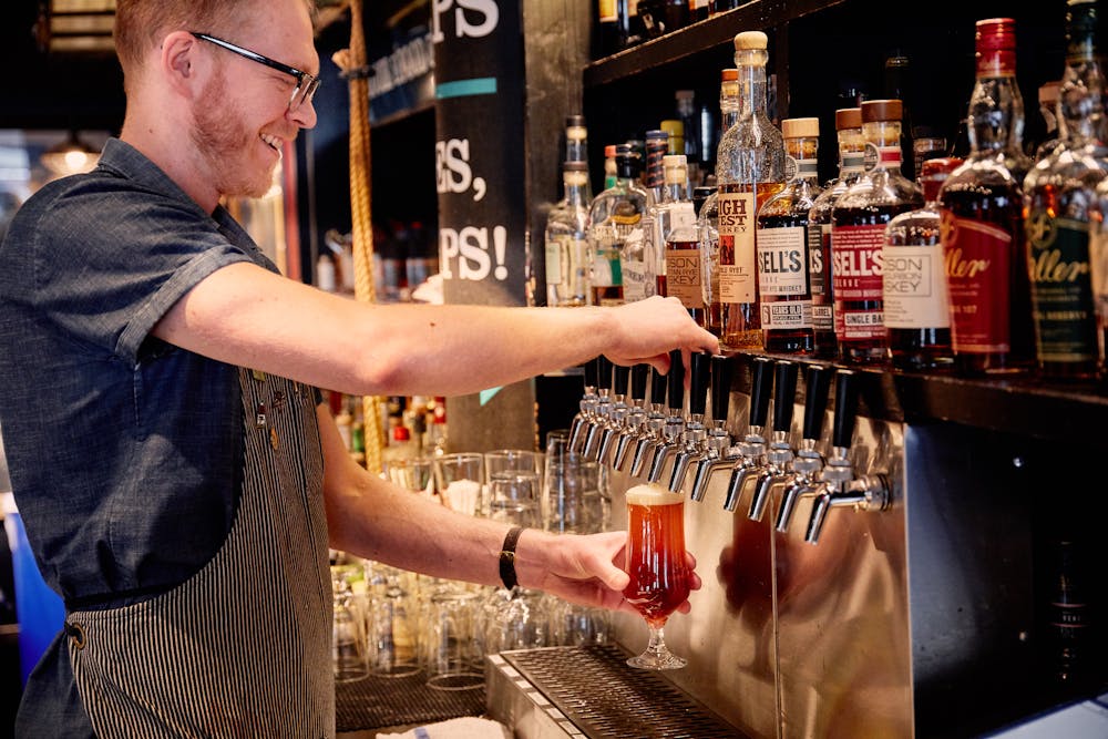 a man cutting a cake