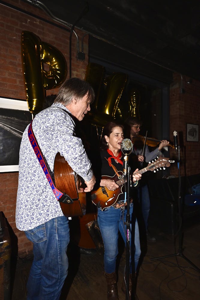 a group of people standing in a room