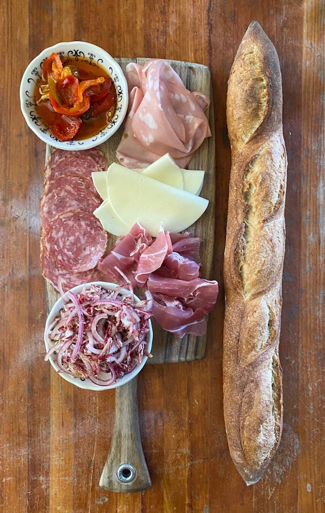 a plate of food sitting on top of a wooden table