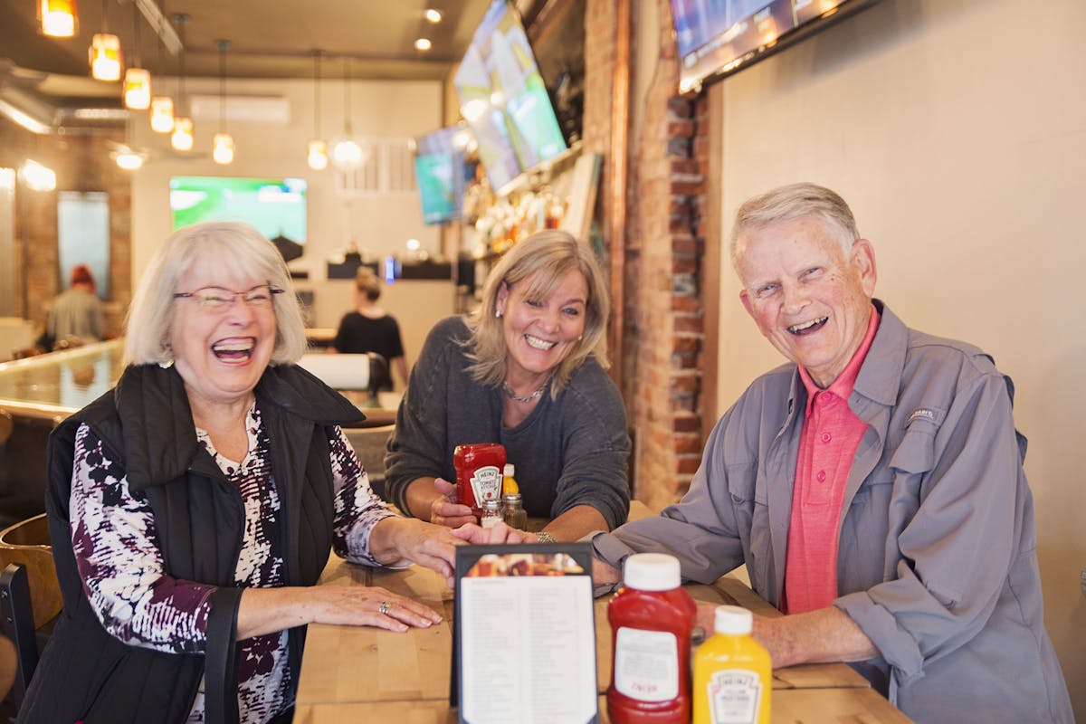 a group of people sitting at a table