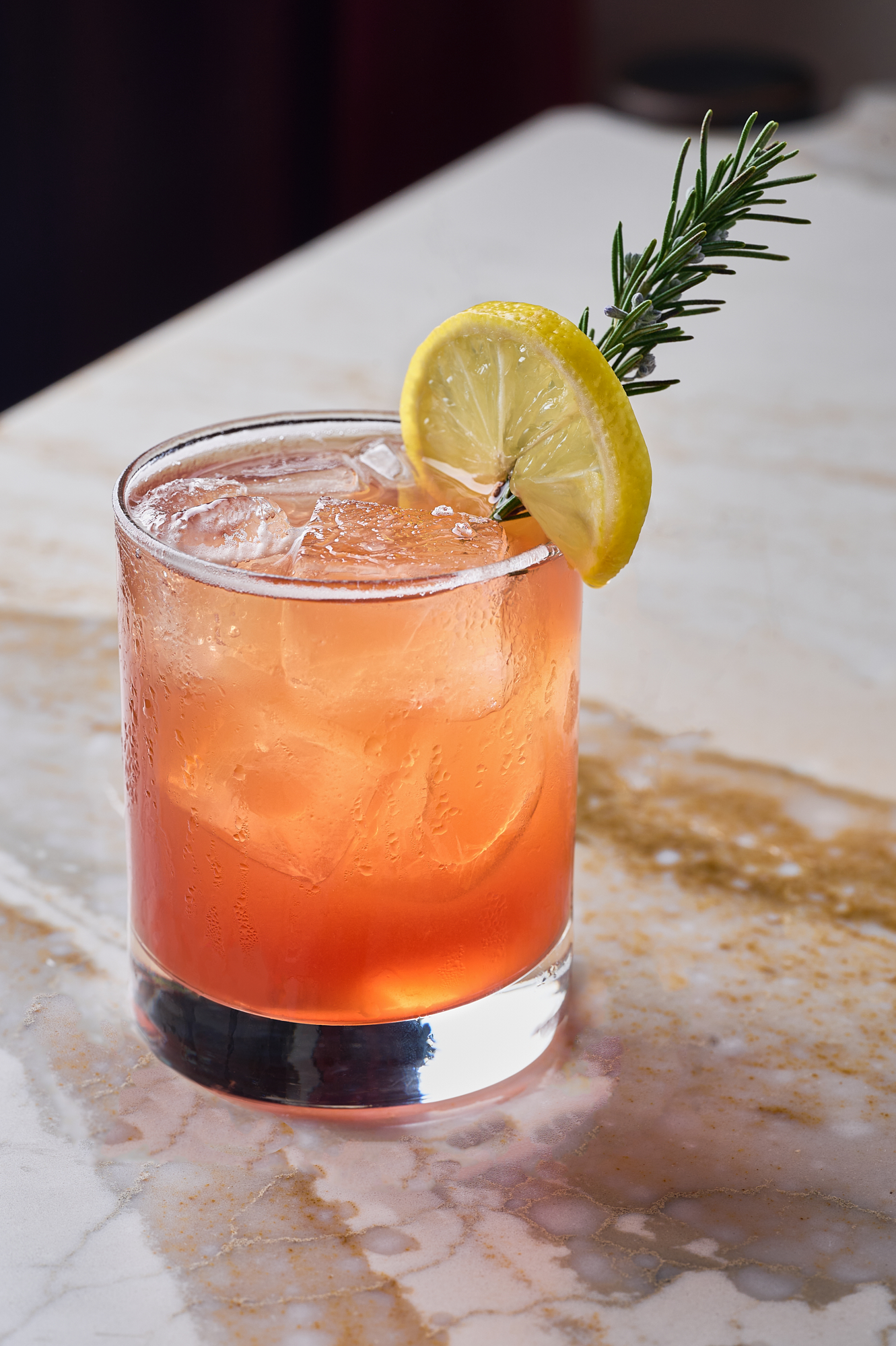 a glass of orange juice next to a cup of coffee