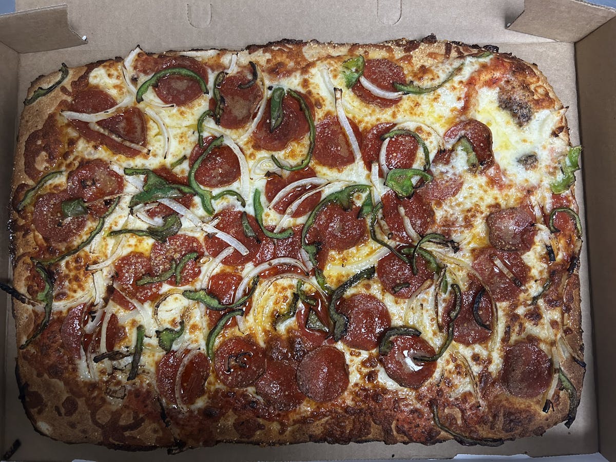 a close up of a pepperoni pizza in a box