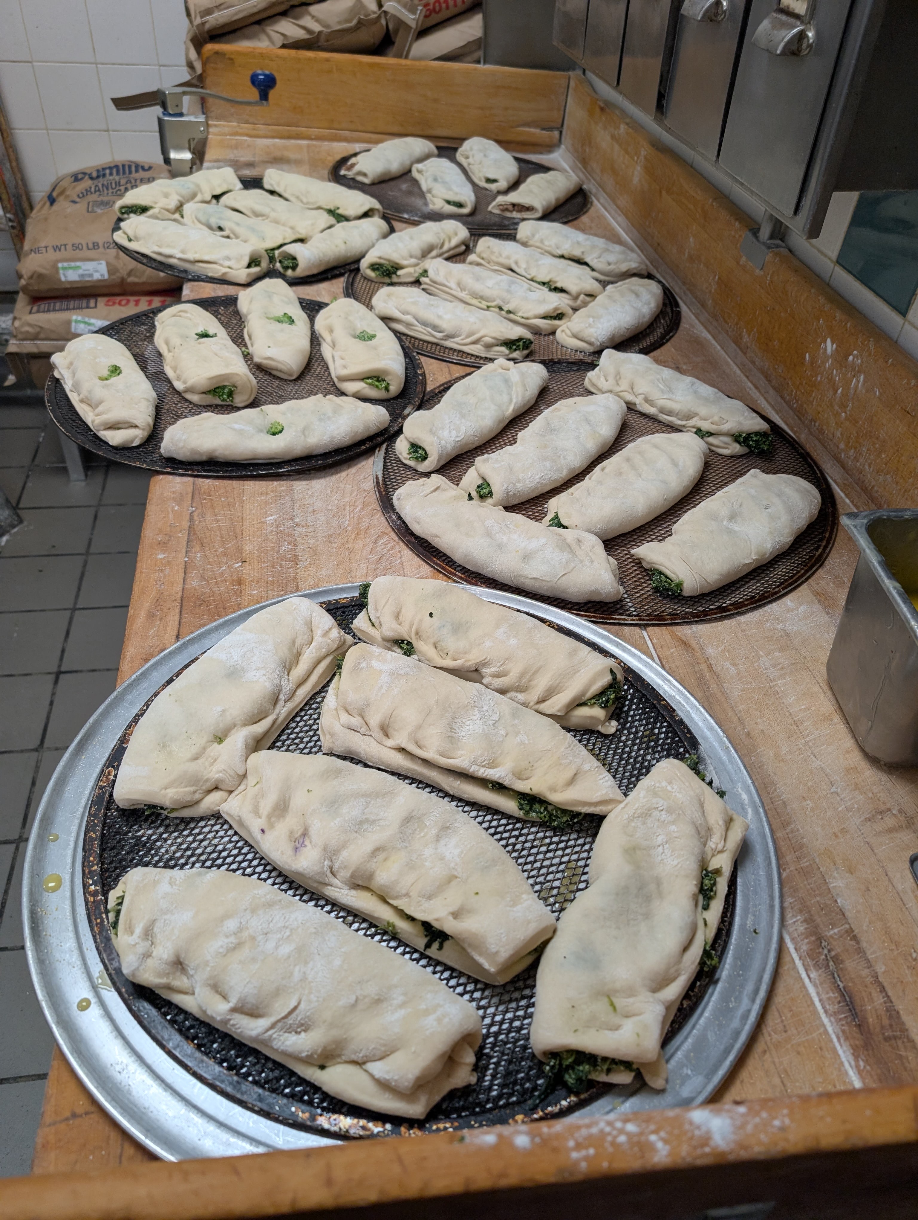 a wooden table topped with plates of food on a plate