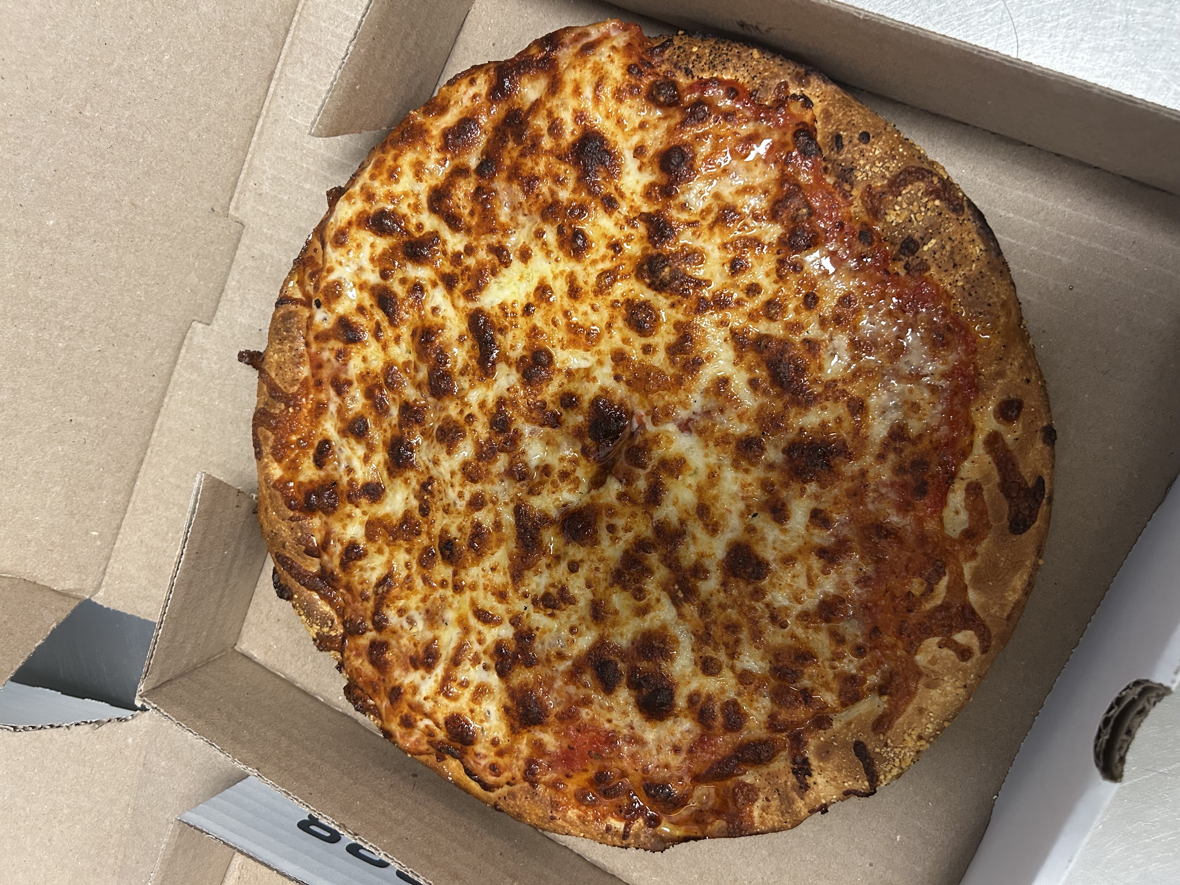 a pizza sitting on top of a box