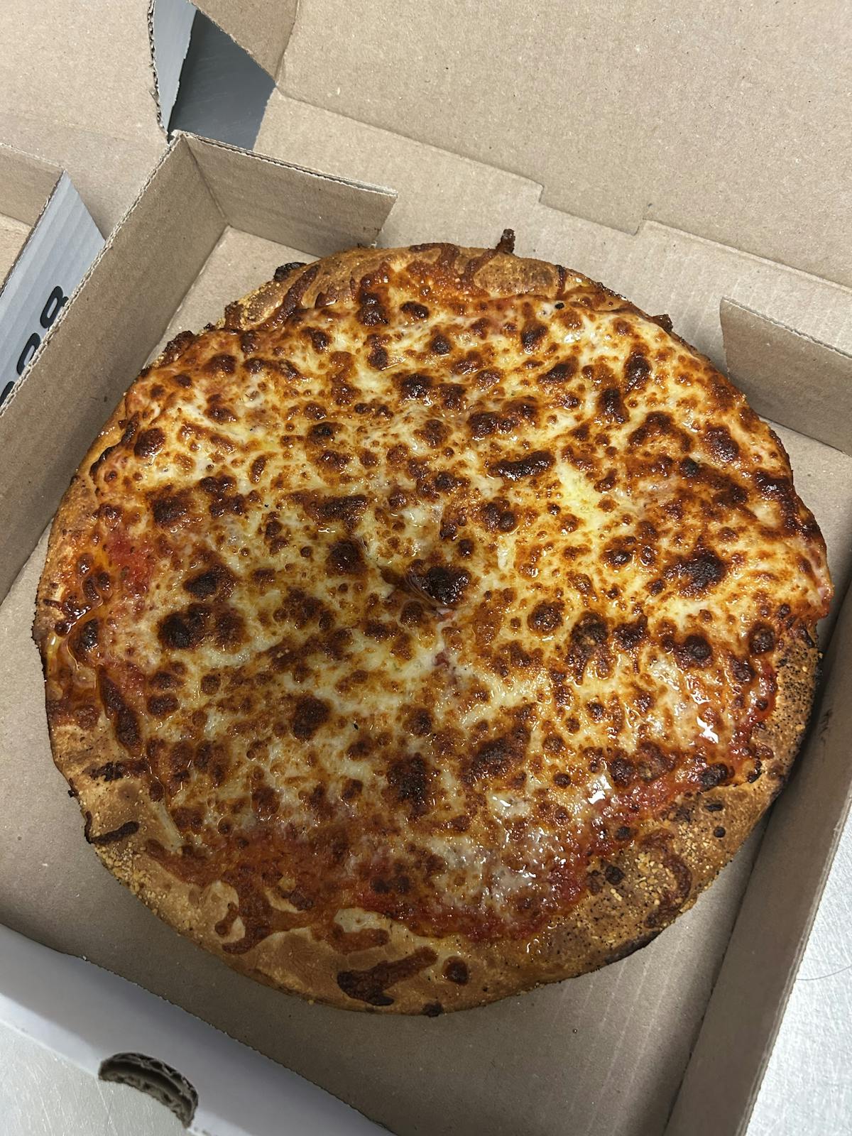 a pizza sitting on top of a box