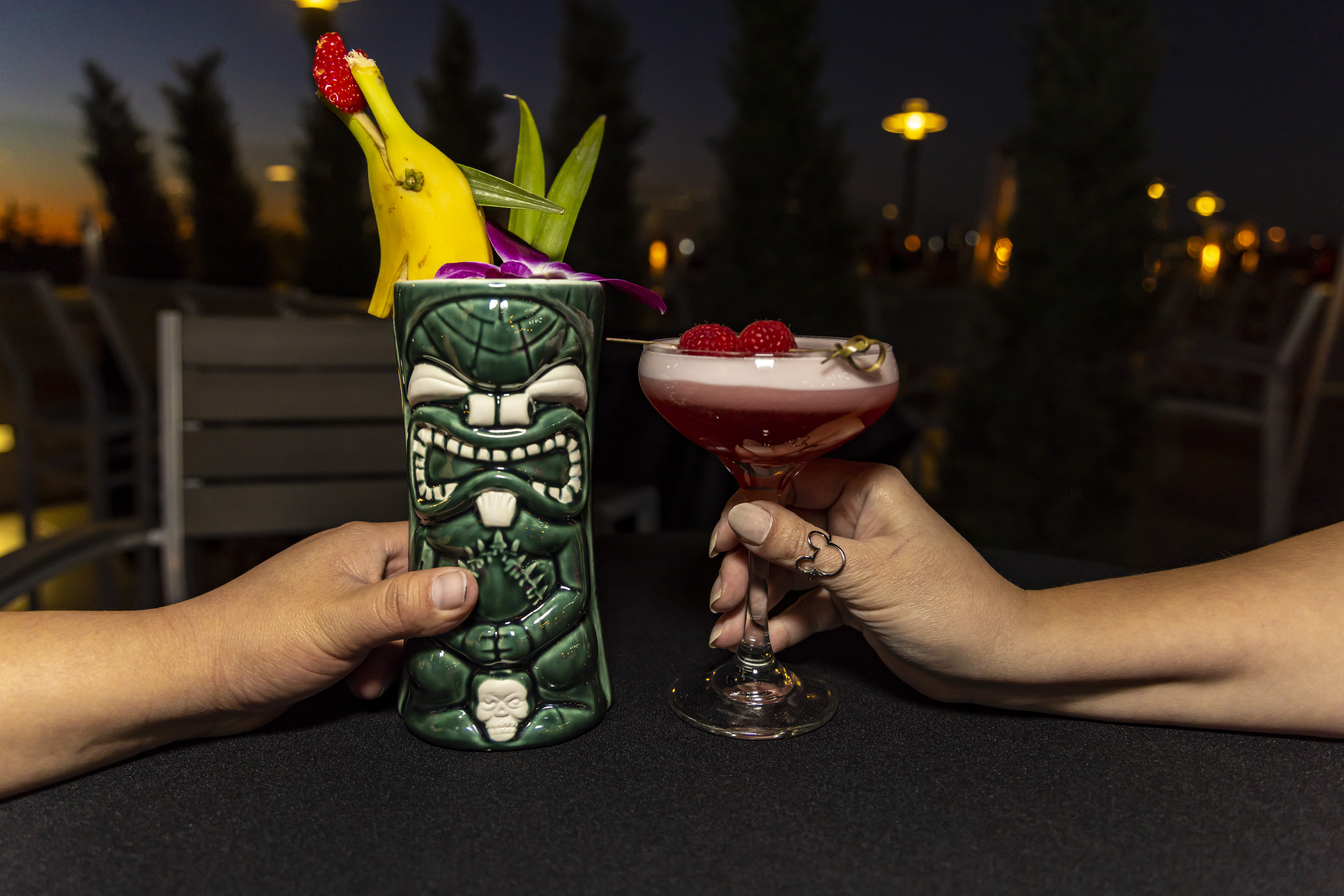 couple holding drinks