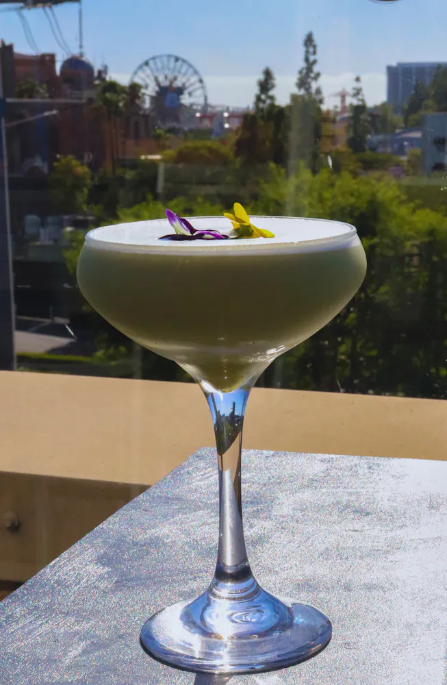 a glass with a drink on it