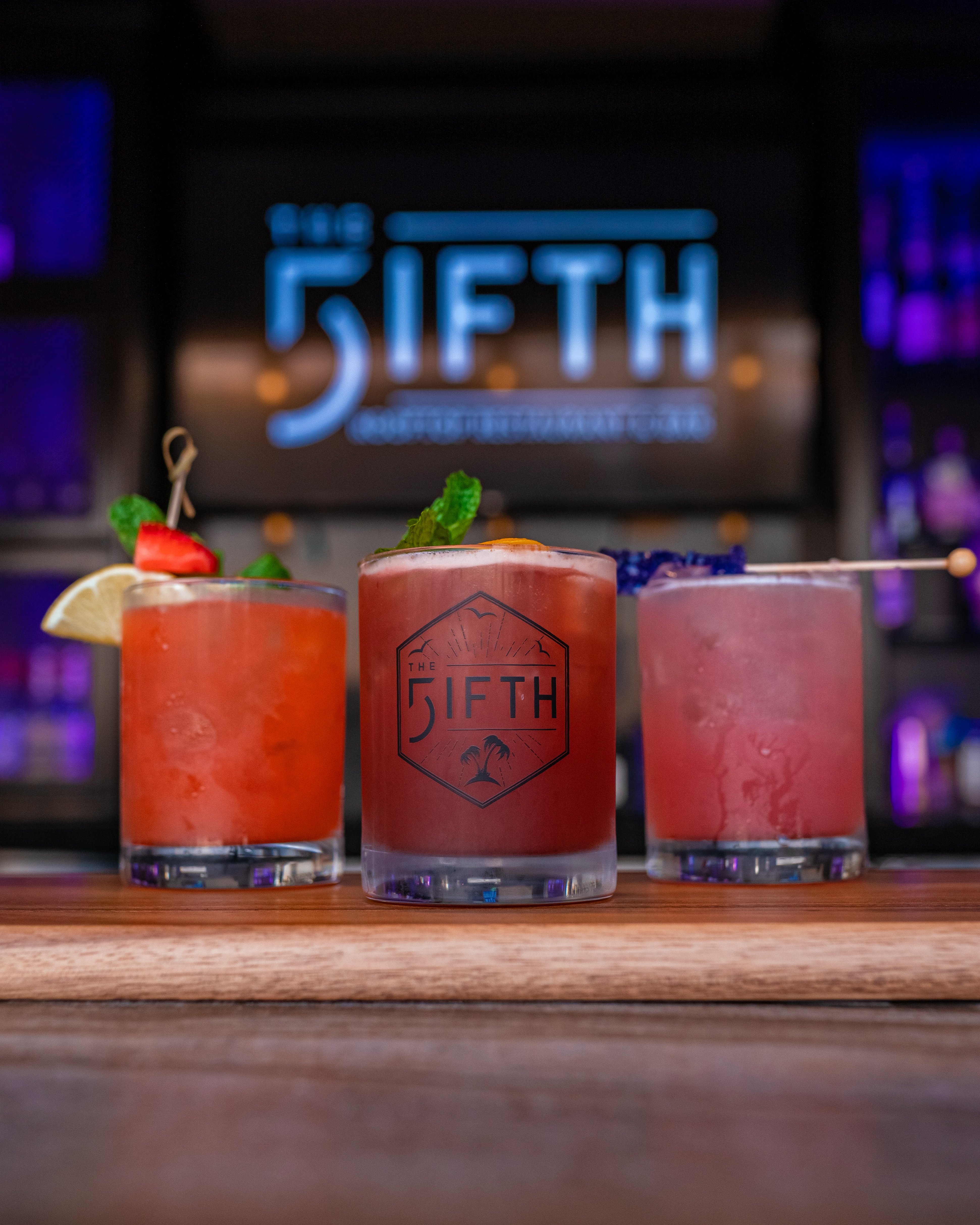 three drinks in front of tv