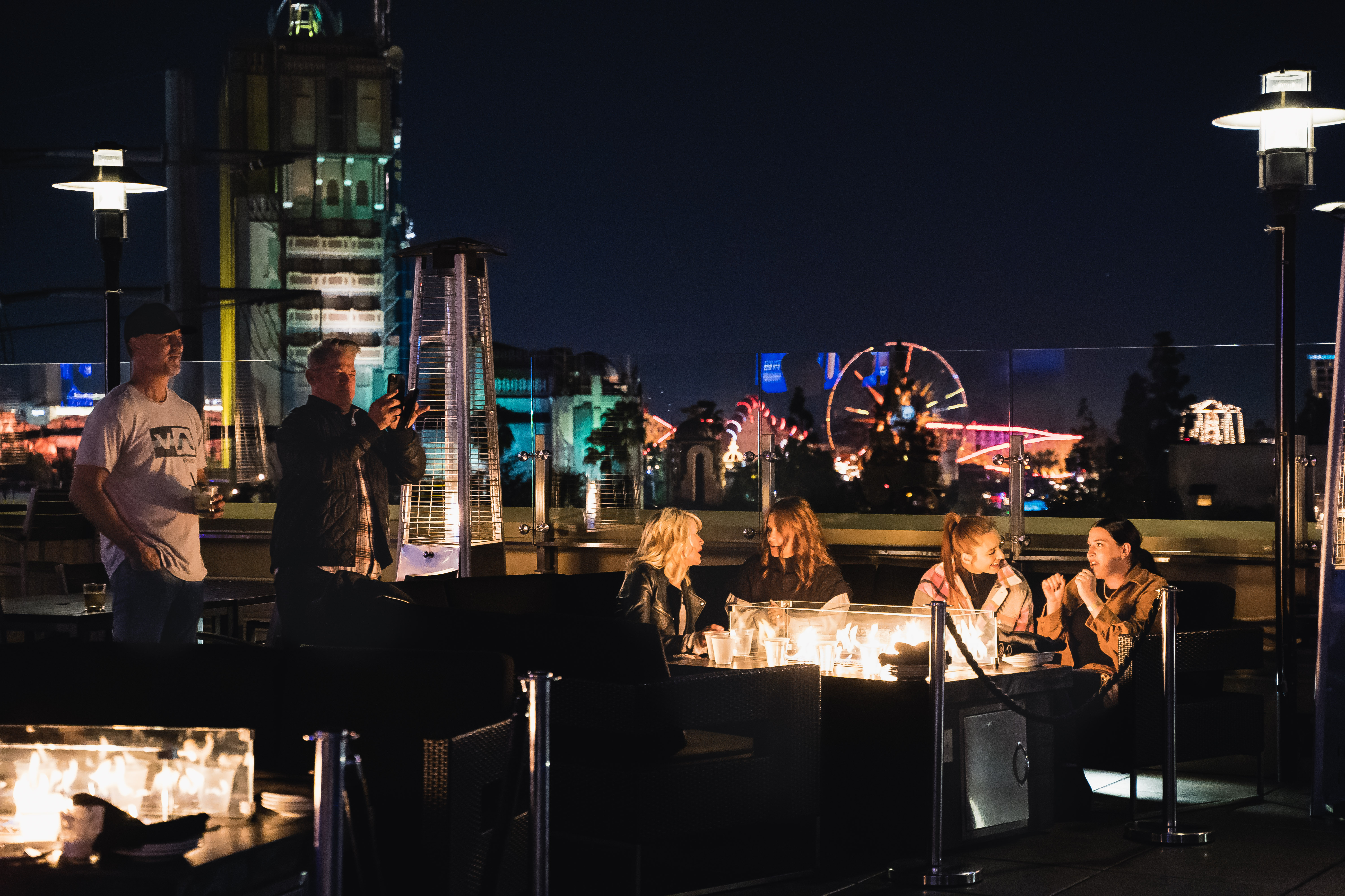 a group of people standing in front of a bar