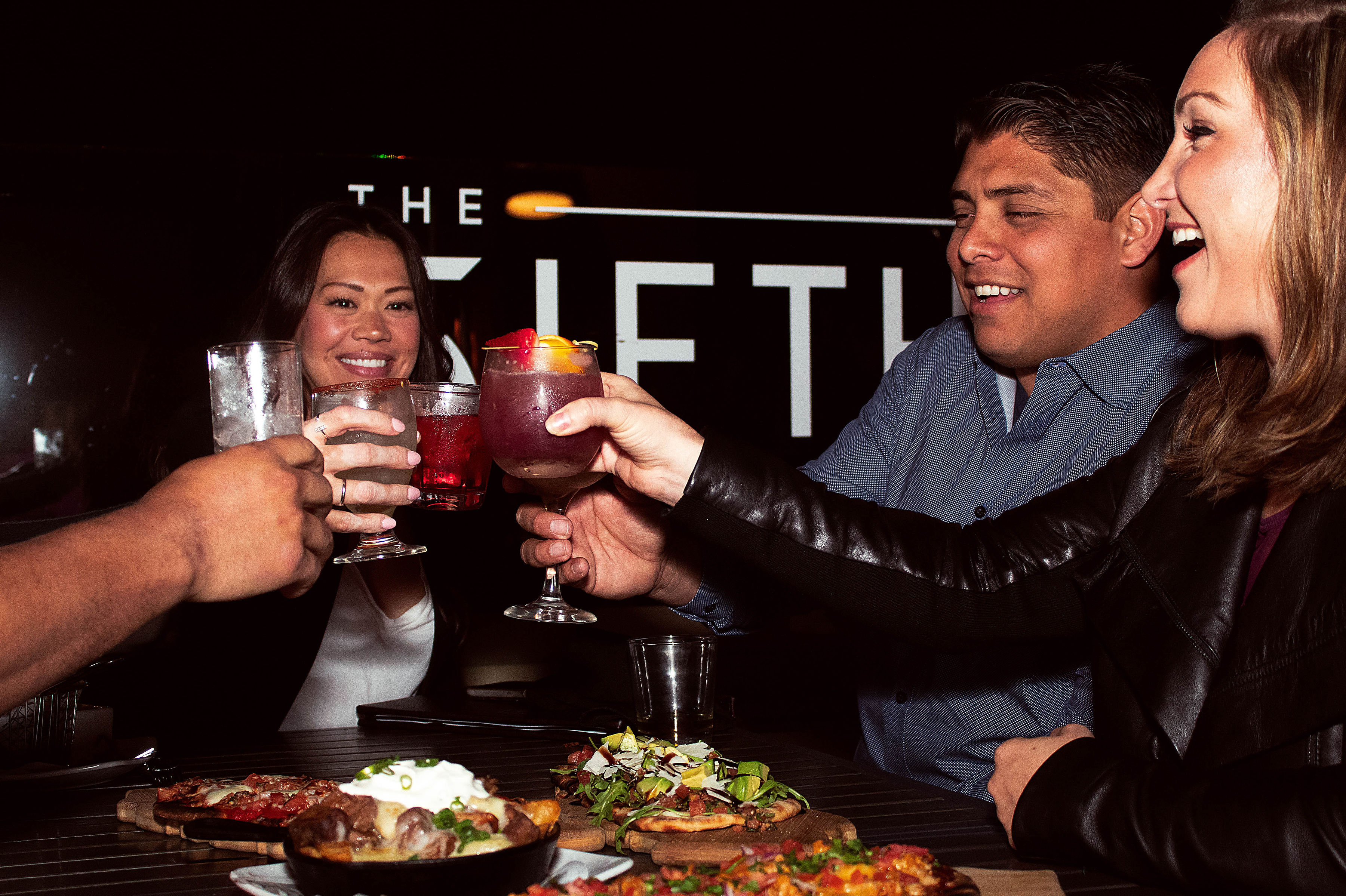 a man holding a drink