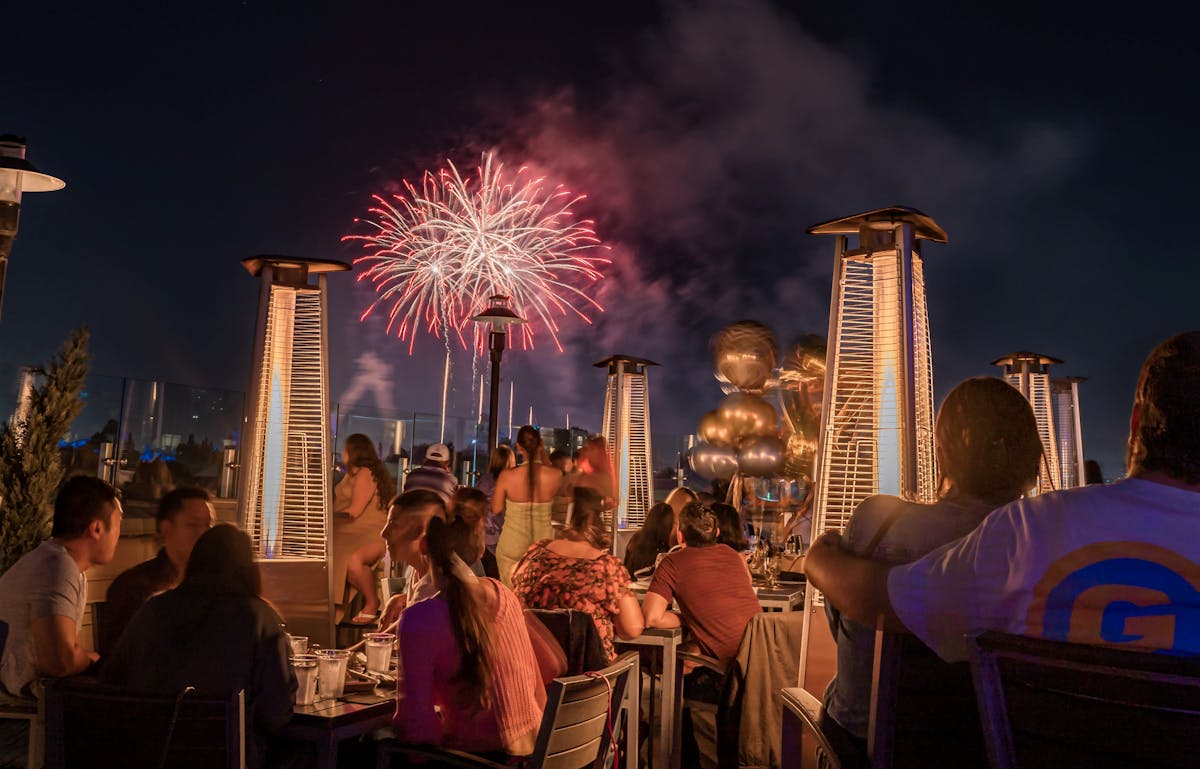 a crowd watching fireworks