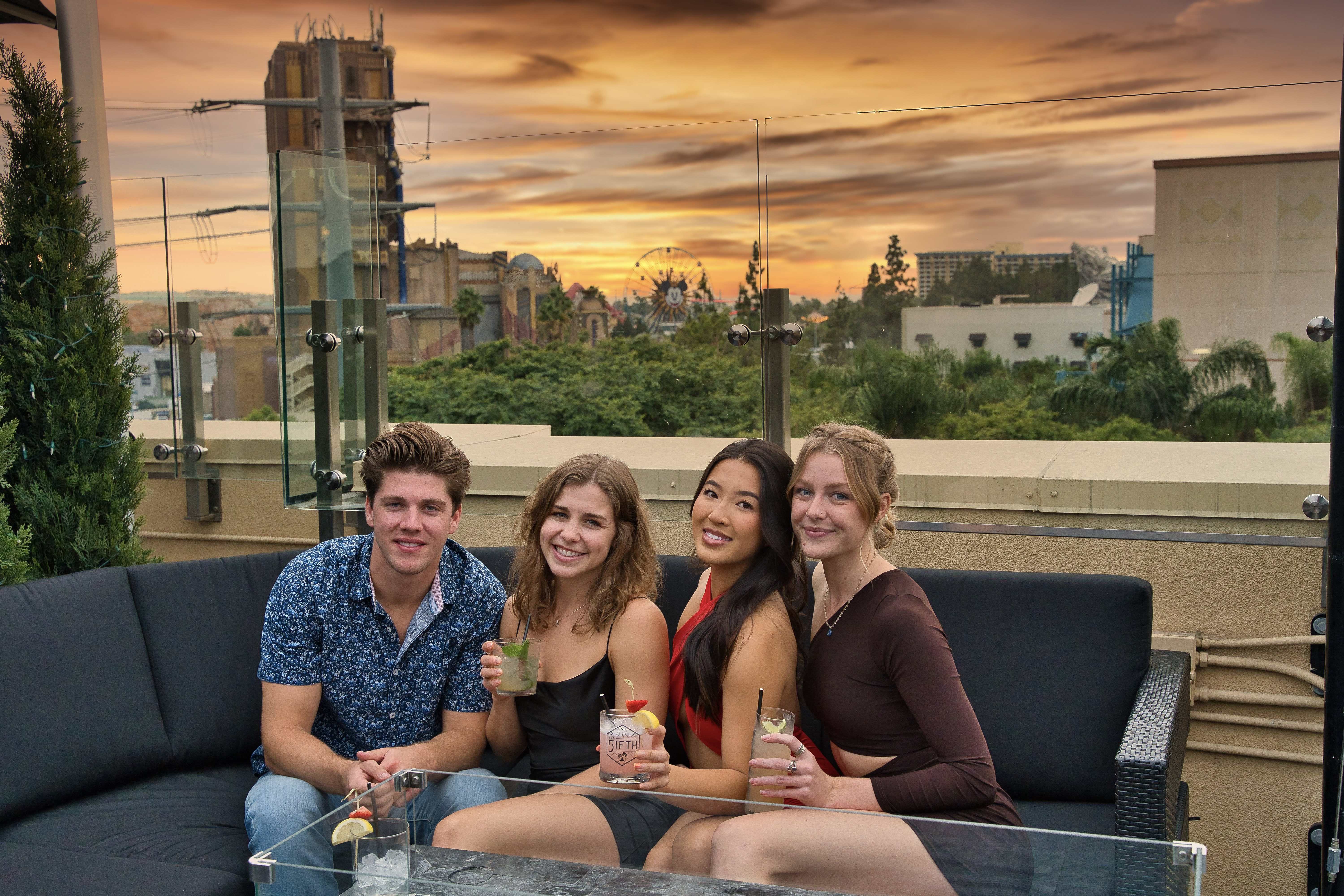 a group of people sitting on a VIP Couch