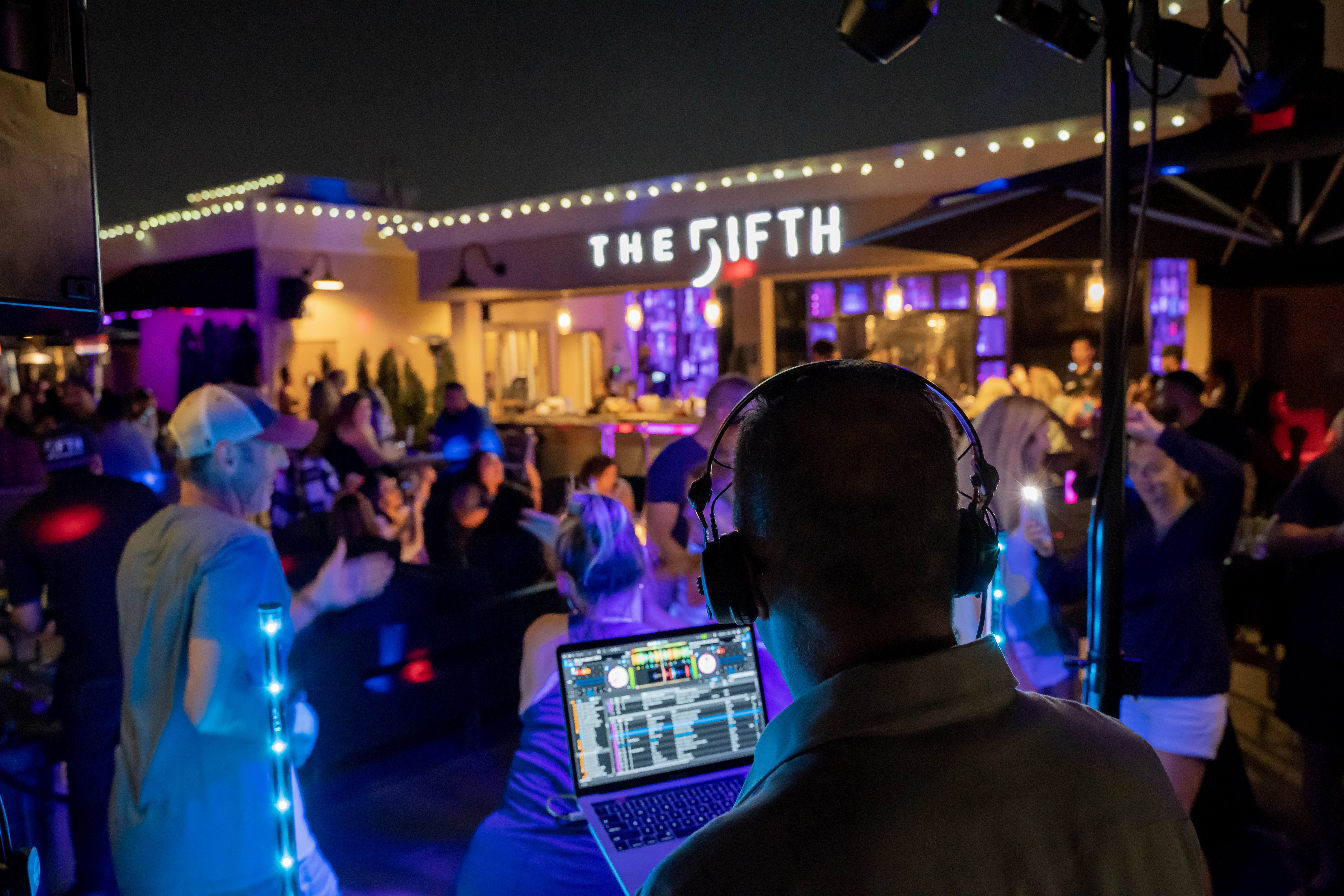 dj playing and people dancing