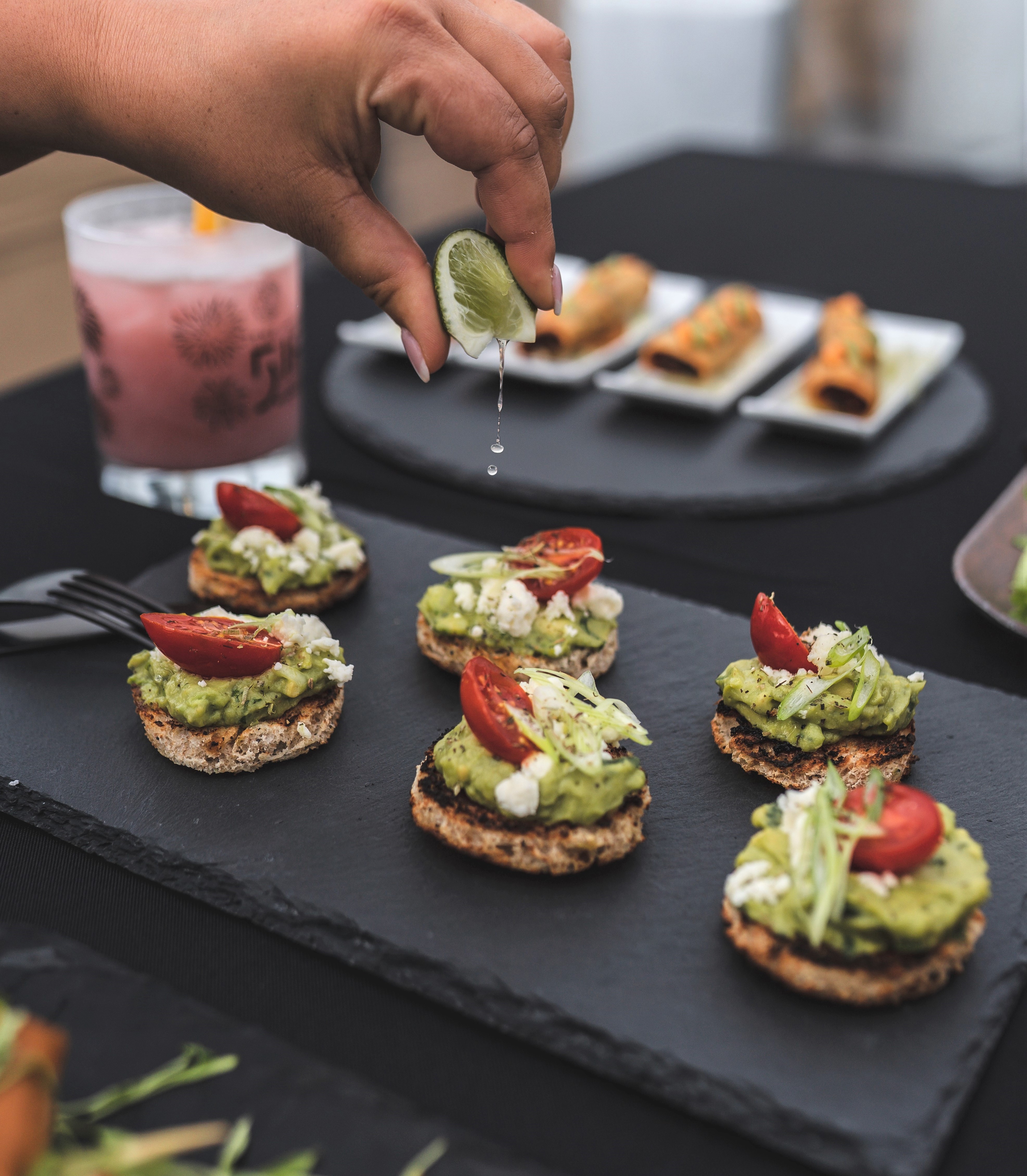 squeezing lime onto avocado toast